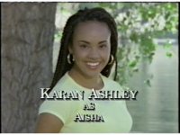 Aisha turns to us, smiling.