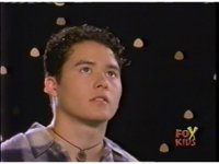 Close on Aisha as he looks conc...